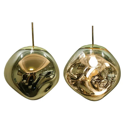 Lampe en forme de bulle, coloris or, conçue avec des matériaux de haute qualité pour une décoration sophistiquée.