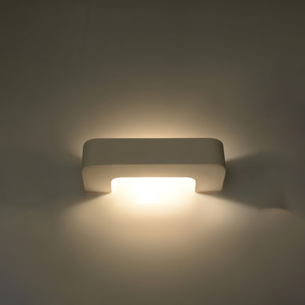 Applique agrafe céramique diffusant un double halo de lumière