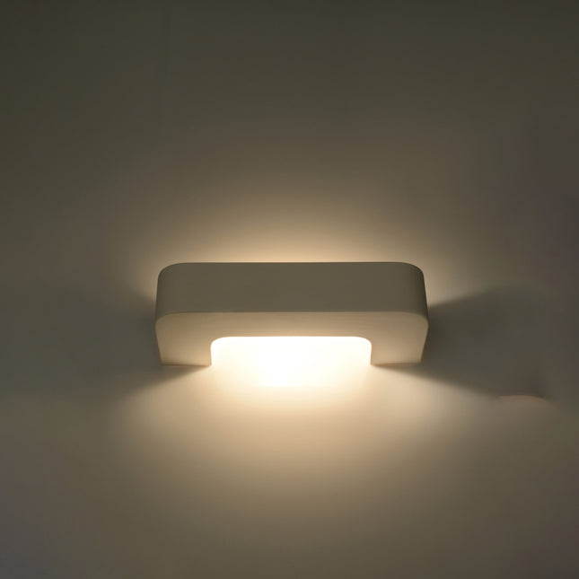 Applique agrafe céramique diffusant un double halo de lumière