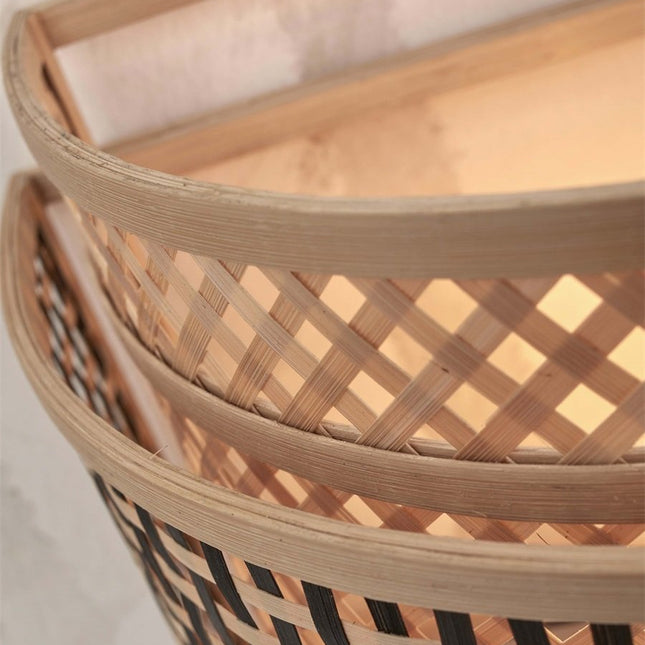 Detail of the natural bamboo weave of the lampshade of the Bhutan wall light seen from above