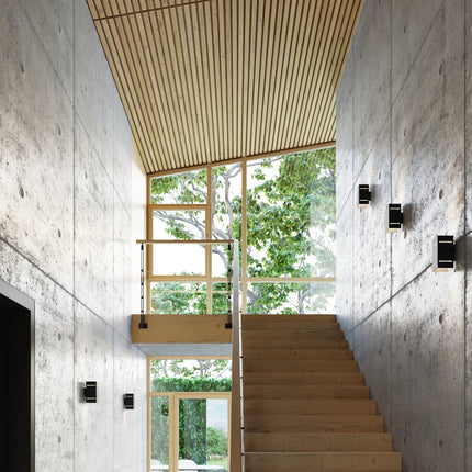 Applique Bloc Minimaliste en Aluminium Noir en situation, éclairage bidirectionnel haut et bas