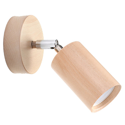 Détail de l'applique en hêtre naturel : platine ronde, rotule chromée et tête cylindrique