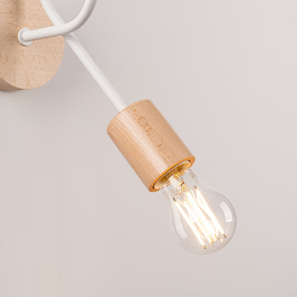 applique murale à bras bouclé en bois et métal blanc, détail de la matière