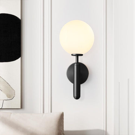 Applique murale cylindre moderne noire dans une chambre graphique
