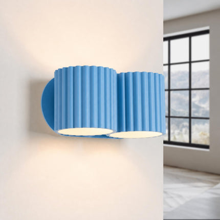 Applique Murale Double Aura bleu ciel allumée, quatre faisceaux vers le haut et le bas