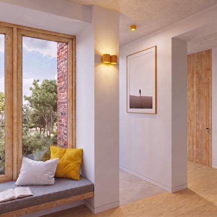Applique Murale Double Aura jaune près d'une tête de lit