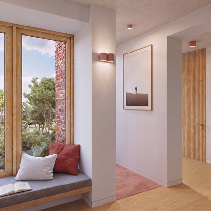 Applique Murale Double Aura pêche près d'une tête de lit