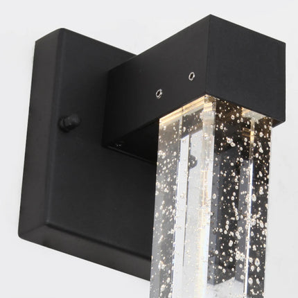 Détail du support carré en aluminium noir et du haut de la barre de cristal à bulles
