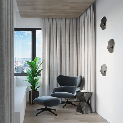 Applique murale géométrique Tre noire dans une ambiance déco chaleureuse