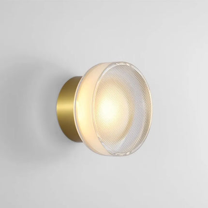 Applique murale LED ronde espagnole coloris noir sur un mur clair