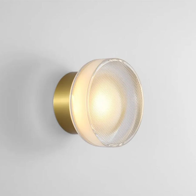 Applique murale LED ronde espagnole coloris noir sur un mur clair