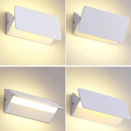 Applique murale orientable utilisée en liseuse près d'un lit