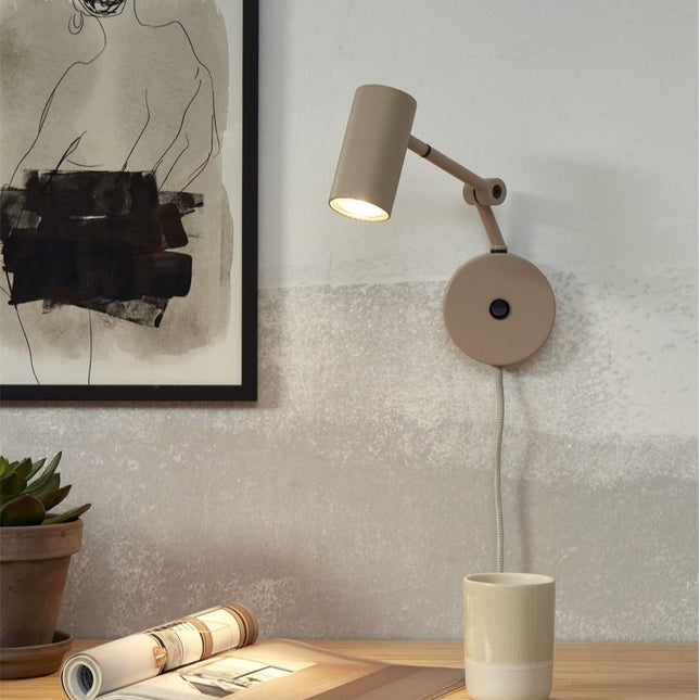 Sand iron Montreux wall light above a bedside table