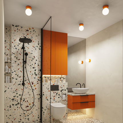 applique murale perle céramique orange ip44, dans une pièce à vivre