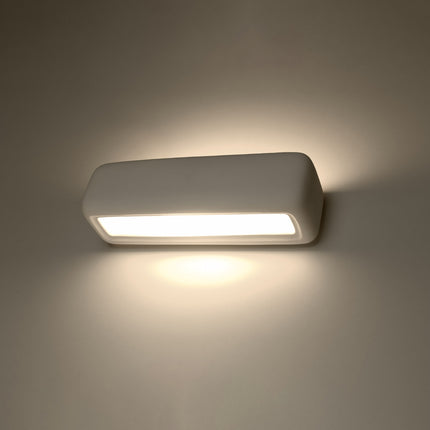 Applique murale céramique blanche allumée, lumière bidirectionnelle chaude sur le mur