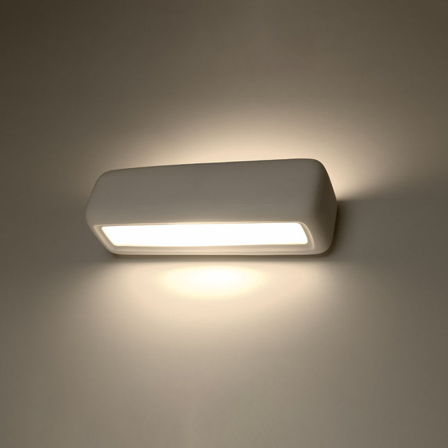 Applique murale céramique blanche allumée, lumière bidirectionnelle chaude sur le mur