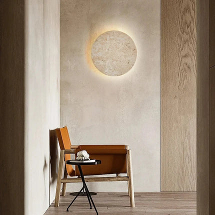 Teinte jaune crème naturelle du travertin de l'applique murale ronde