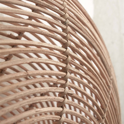 Detail of the handcrafted rattan weave of the Tanami wall light, natural texture and shades
