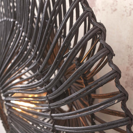Close-up of the texture of the black woven rattan strands of the Zanzibar wall light