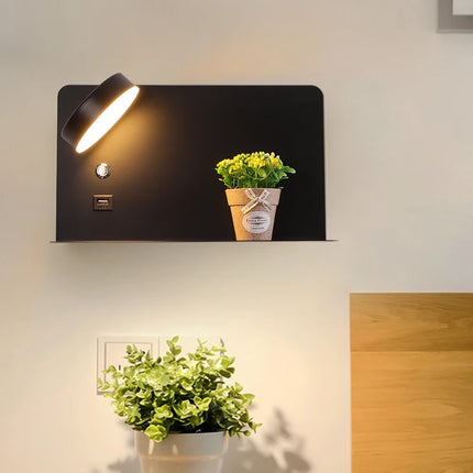 Applique murale support téléphone en noir fixée au mur