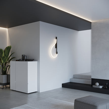 Applique Tube LED Réglable noire éclairant une chambre moderne