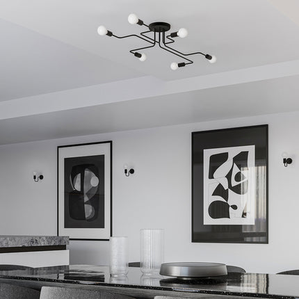 Lustre et appliques Design Flex noirs assortis dans un salon aux tons monochromes