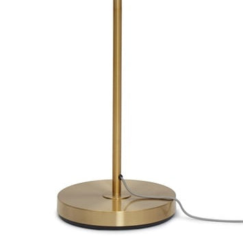 Socle rond en métal doré du lampadaire Carrara avec son câble textile gris