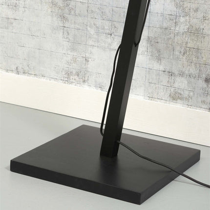 Socle carré en métal noir mat du lampadaire Java, stabilisant le pied incliné