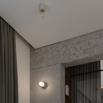 Détail de la lampe à poser Pure Circulaire en béton, gros plan sur la texture