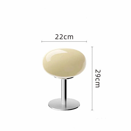 Lampe de chevet sucette nordique jaune sur une table de nuit