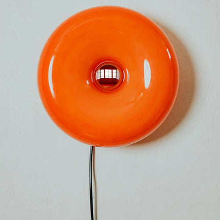 Lampe donut orange fixée au mur en applique