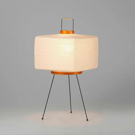 Lampe japonaise en papier de riz sur pied dans un salon zen et minimaliste
