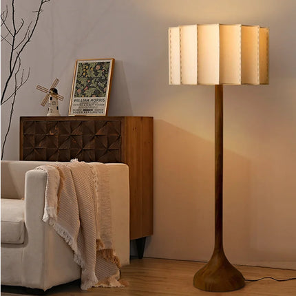 Lampe patte d'éléphant en bois à ampoule LED E27 pour une chambre à coucher.