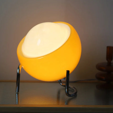 Lampe à poser circulaire orange et ses trois températures de lumière