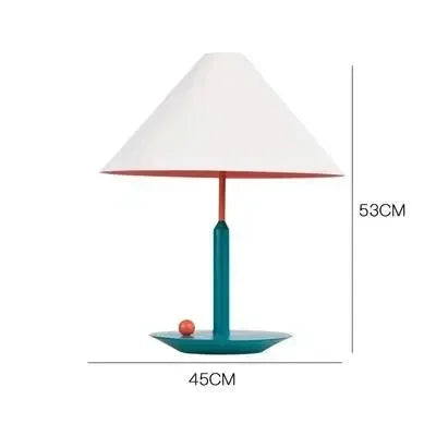 Lampe de table LED design coloré en finition vert sur un bureau minimaliste