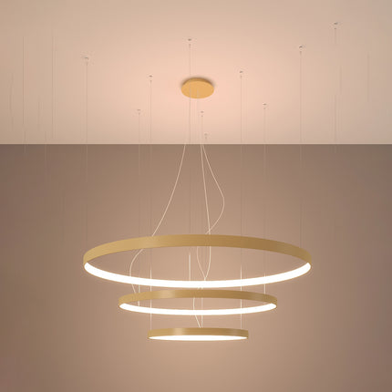 Lustre Anneau Solis 3 anneaux dorés allumé, halos concentriques
