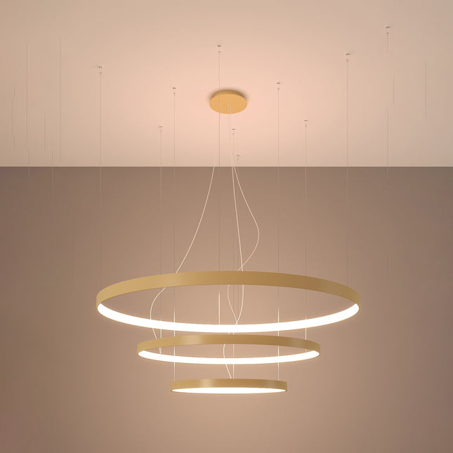 Lustre Anneau Solis 3 anneaux dorés allumé, halos concentriques