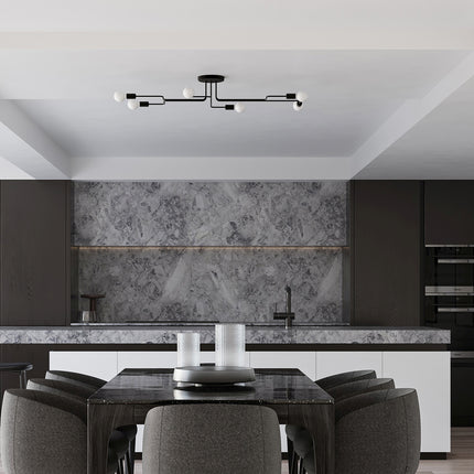 Lustre Design Flex 6 bras noir au-dessus d'une table dans une cuisine contemporaine