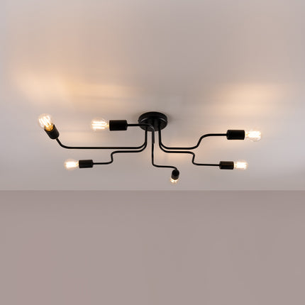 Lustre Design Flex 6 bras noir allumé sur fond beige