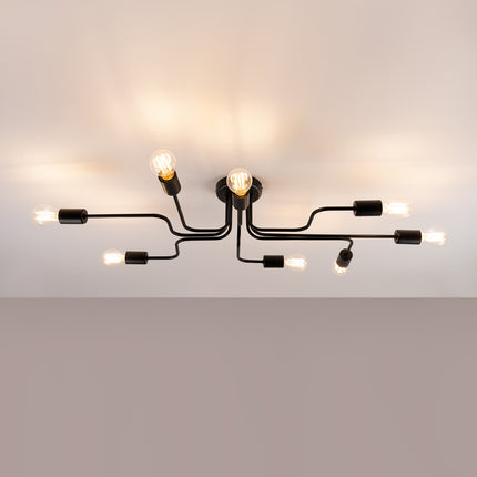 Lustre Design Flex 8 bras noir allumé sur fond beige