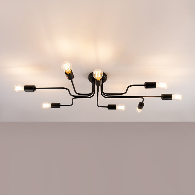 Lustre Design Flex 8 bras noir allumé sur fond beige