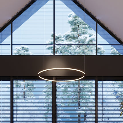 Lustre Ring Éclat noir allumé au-dessus d'un espace de vie design