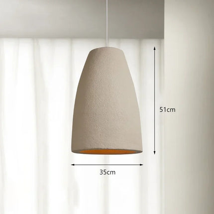 Lustre style japonais créant une ambiance minimaliste et chaleureuse grâce à son abat-jour tissé à la main.