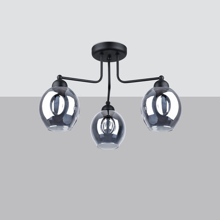 Plafonnier 3 lumières verre creusé fumé noir mis en situation dans un intérieur épuré