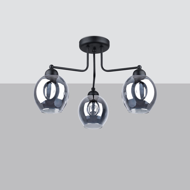 Plafonnier 3 lumières verre creusé fumé noir mis en situation dans un intérieur épuré
