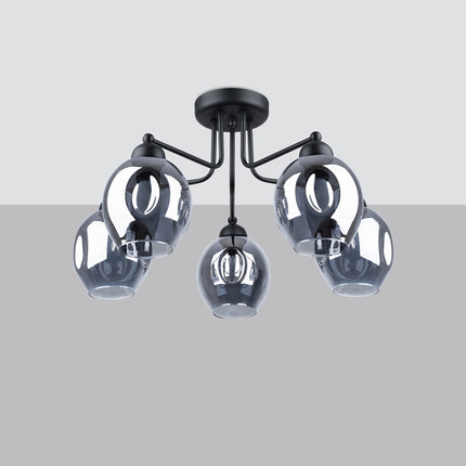 Plafonnier 5 lumières verre creusé fumé noir mis en situation dans un intérieur épuré