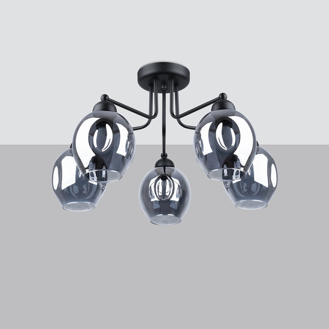 Plafonnier 5 lumières verre creusé fumé noir mis en situation dans un intérieur épuré