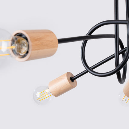 plafonnier 5 bras bouclés en bois et métal noir, détail de la matière