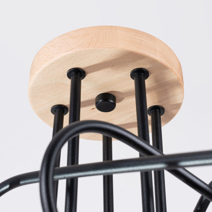 plafonnier 5 bras bouclés en bois et métal noir, mécanisme de montage