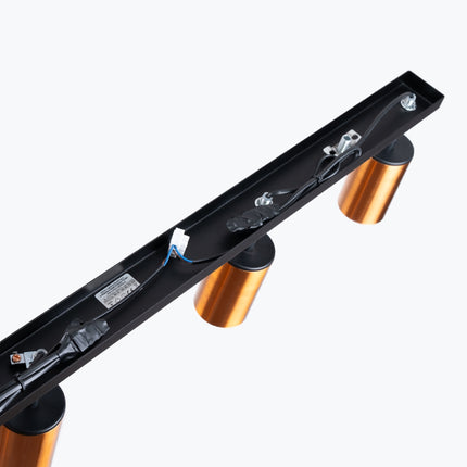 Détail des spots cuivrés du Plafonnier Acier Luxe 4 Barre, gros plan